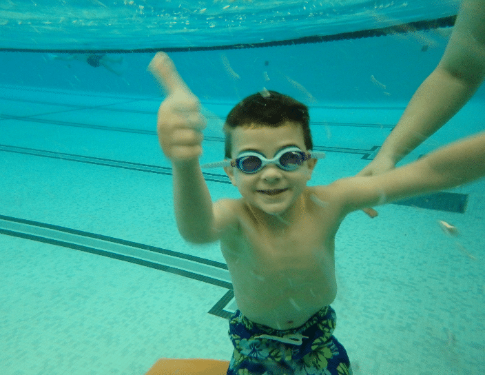 Child Swimming Underwater