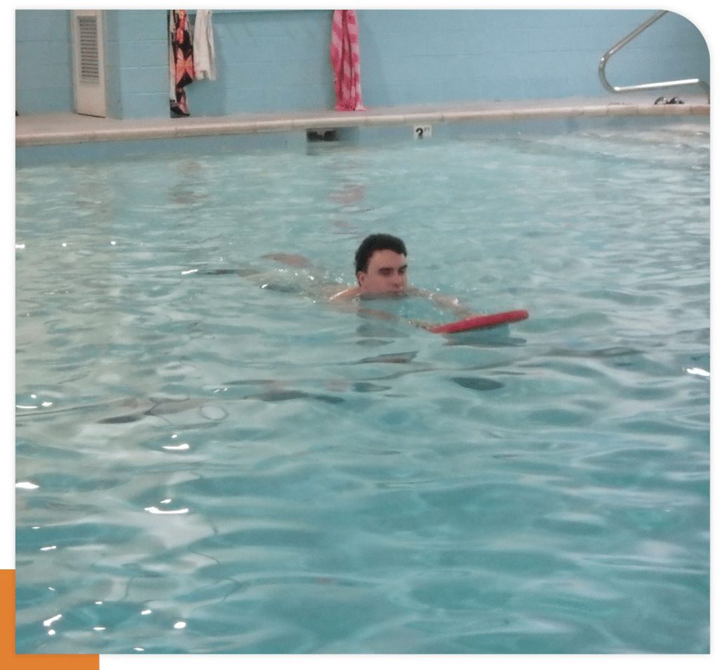 Aquatic Therapy Swimmer with a Kickboard