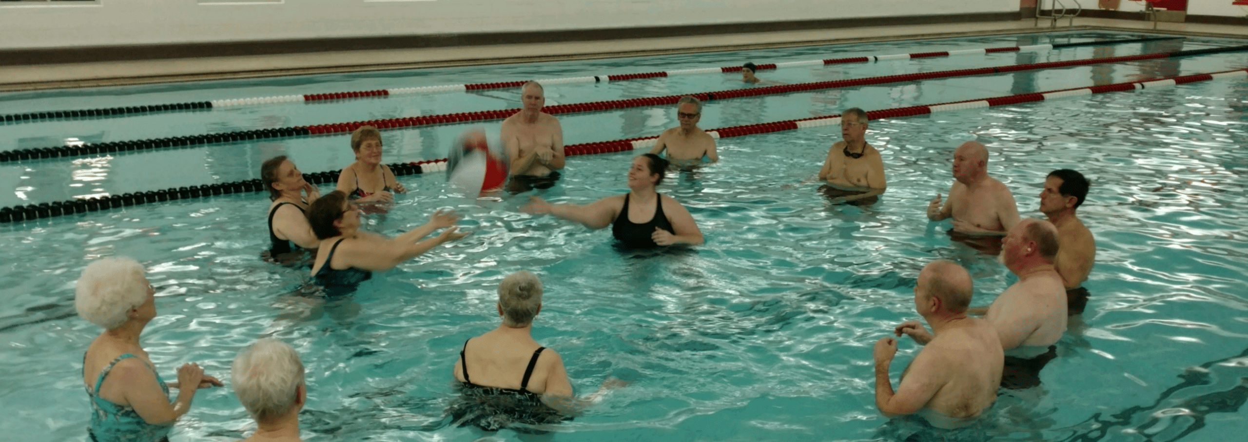 Swimmers Participating in a Group Excercise